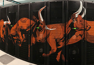 server towers featuring orange longhorn cattle herd design