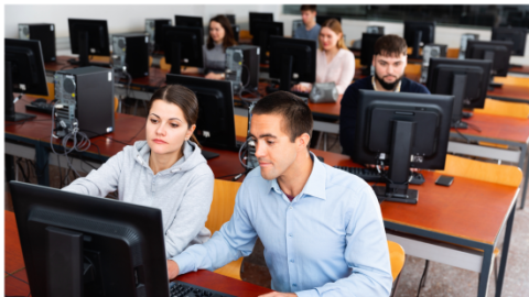 students working on desktop in computer lab