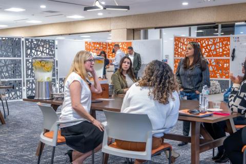 Business professionals gathered around a table