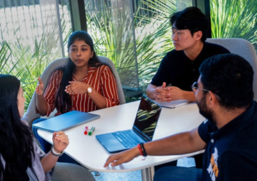 students in small group discussion
