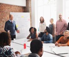 diverse team of professionals meeting in conference room