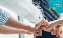 Group of people putting fists together in show of comraderie