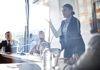 official asserting a point on a panel