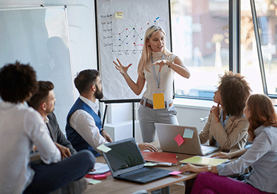 professional presenting to team confidently