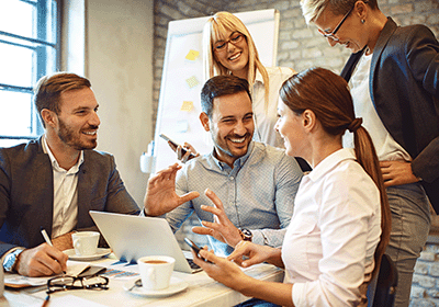 Professionals having a good time working on a project