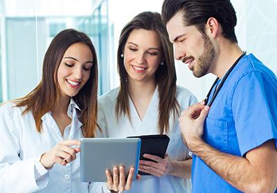 medical professionals looking at tablets