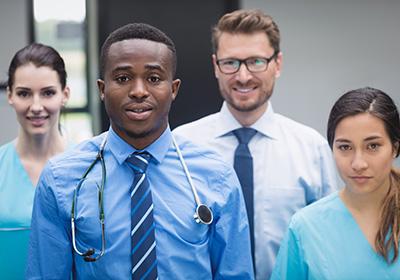 medical professionals smiling directly at camera