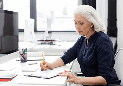 Writer uses pencil to fill out form