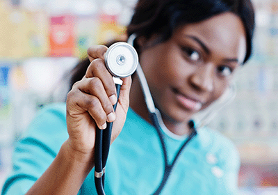 medical processional holding stethoscope up to camera