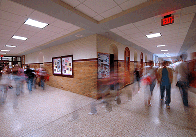 busy hallway with moving students