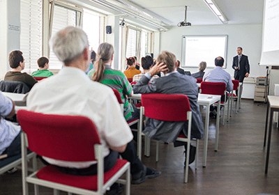 teacher attending a staff meeting