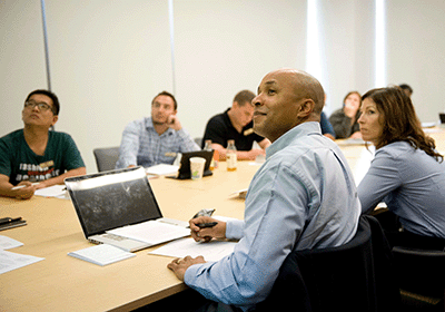 Engaged attendees watching presentation