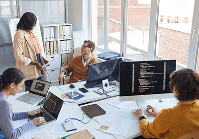 tech colleagues working together in office