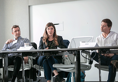 Student speaking to peers in classroom