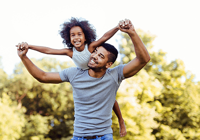 child playing with supportive adult