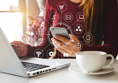 Person using laptop and phone concurrently