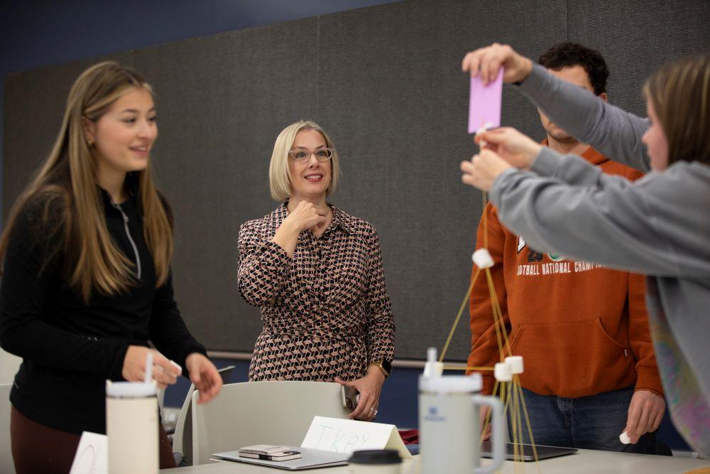 Instructor enthusiastically observing student activity