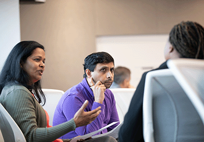 seminar attendees engaged in thoughtful conversation