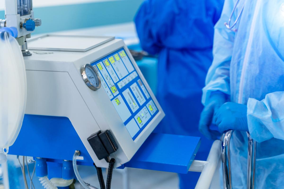 close-up of medical equipment and personell in sterile operating room