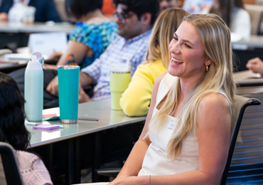 happy student listening attentively in lecture hall
