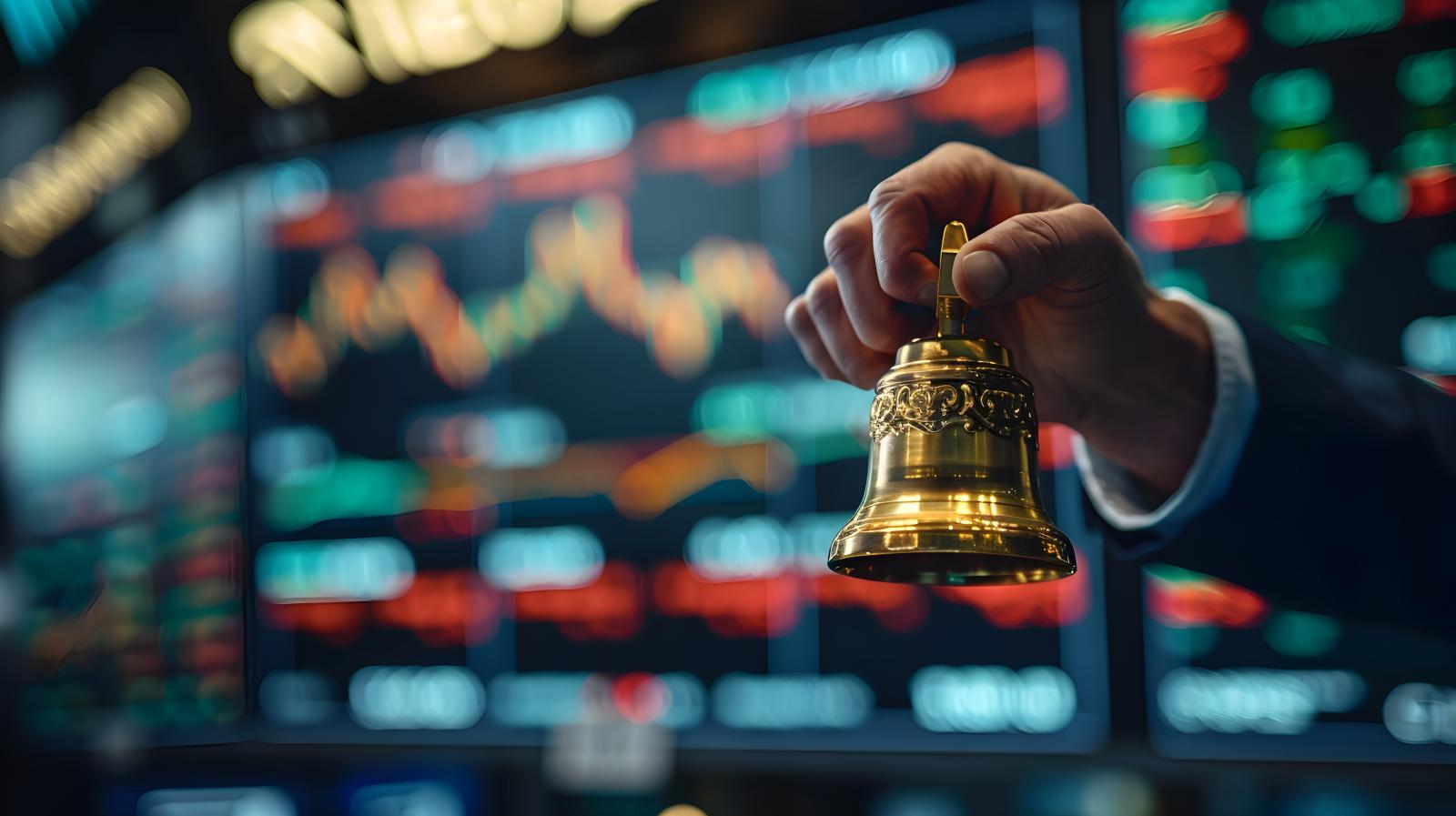 Man ringing bell at the stock exchange