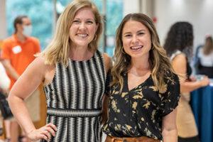 two professional women at networking event